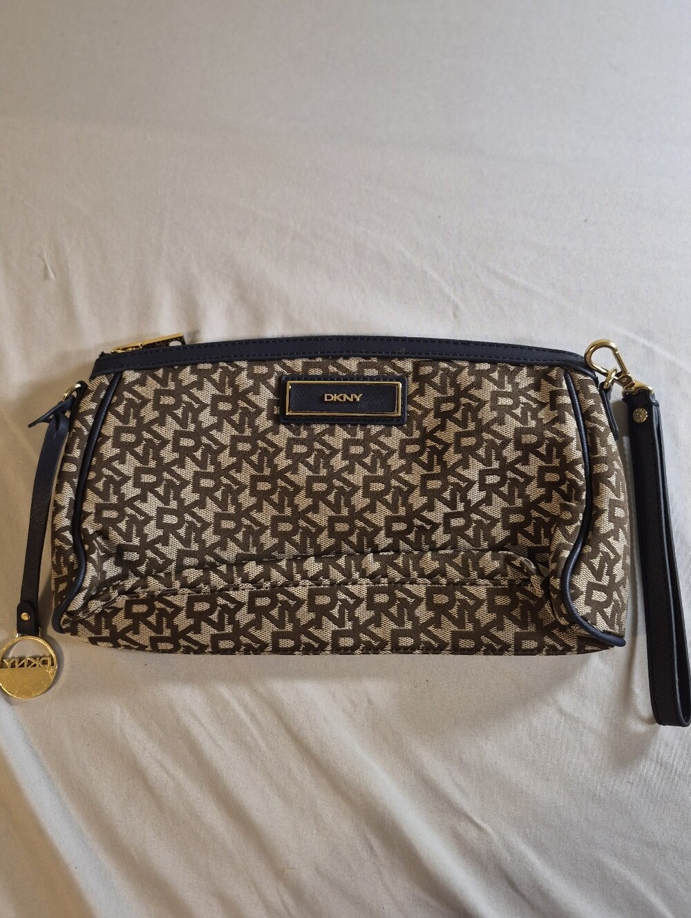 DKNY Brown Logo Wristlet with Navy Trim and Gold Hardware